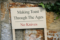 Making Toast Through The Ages - No Knives sign